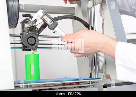 Scientist working with three-dimensional  printer Stock Photo