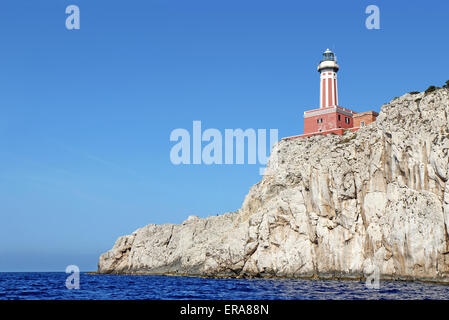 Punta Carena ligthhouse on the southwest coast of the island of Capri, Italy, viewed from the water Stock Photo