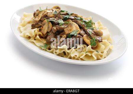 beef stroganoff with pasta, russian cuisine isolated on white background Stock Photo