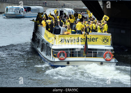 FILE - a file picture dated 17 May 2014 shows BVB fans taking a trip on the river Spree in Berlin, Germany. Photo: Federico Gambarini/dpa Stock Photo