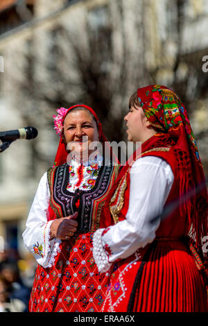 Two  Bulgarian folklore singers  performing a folklore song during the traditional folklore festival '1000 national costumes' Stock Photo