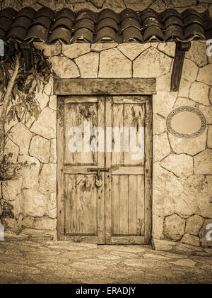 Vintage style old locked colonial doors of mexican hacienda Stock Photo