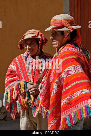 Quechua men in traditional clothing with musical instruments in ...