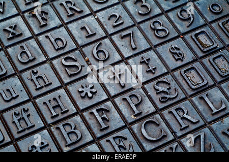 Cast iron letters and numbers flooring in norfolk england UK europe Stock Photo