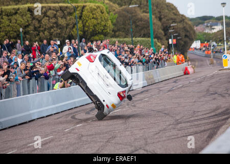 Bournemouth, UK 30 May 2015. The second day of the Bournemouth Wheels Festival. For the finale Paul Swift drives his Ford Escort on two wheels along the length of the East Overcliff Drive Credit:  Carolyn Jenkins/Alamy Live News Stock Photo