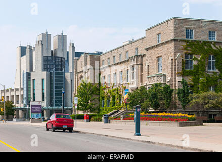 KINGSTON, CANADA - AUGUST 2, 2014: Union Street with modern Stauffer library and historic Students Memorial Union buildings on Q Stock Photo