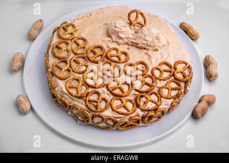 The sweet and salty chocolate cake with peanut butter icing and decorated with pretzels for added crunch. Stock Photo