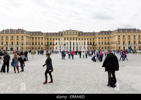 Vienna, Austria - May 1, 2015: Tourists are visiting the former imperial summer residence known as Schonbrunn Palace. Stock Photo