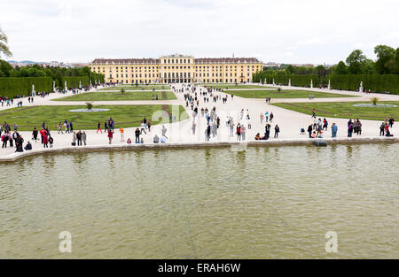 Vienna, Austria - May 1, 2015: Tourists are visiting the former imperial summer residence known as Schonbrunn Palace. Stock Photo