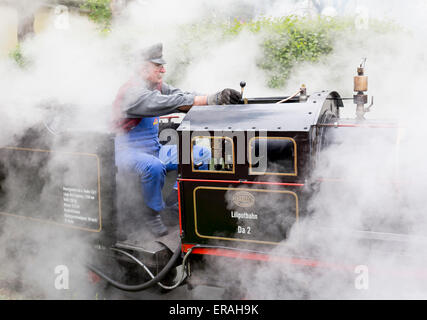 Vienna, Austria - May 2, 2015: Tourists and a train driver enjoy a ride on the so called Liliputbahn. A gauge light railway in t Stock Photo