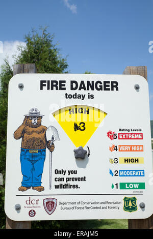 Smokey the Bear fire warning sign notifies of spring drought hazard in small Berkshire town of Adams Massachusetts. Stock Photo