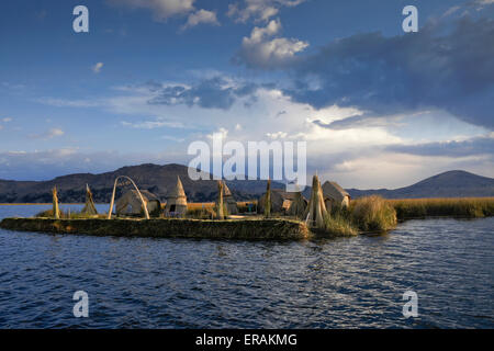 Floating island and houses made of tortora reeds, Lake Titicaca, Puno, Peru Stock Photo