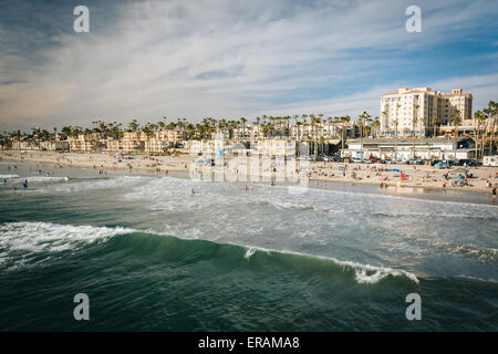 Waves in the Pacific Ocean and view of the beach from the pier in Oceanside, California. Stock Photo
