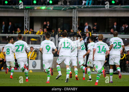 Berlin, Germany. 30th May, 2015. Players of VfL Wolfsburg celebrate for goal during the German Cup (DFB Pokal) final soccer match against Borussia Dortmund in Berlin, Germany, on May 30, 2015. VfL Wolfsburg won 3-1 to claim the champion. © Zhang Fan/Xinhua/Alamy Live News Stock Photo