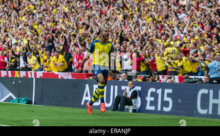 London, UK. 30th May, 2015. Arsenal's Theo Walcott celebrates scoring their first goal during the FA Cup Final between Aston Villa and Arsenal at Wembley stadium in London, Britain, on May 30, 2015. Arsenal won the FA Cup after winning 4-0. Credit:  Richard Washbrooke/Xinhua/Alamy Live News Stock Photo