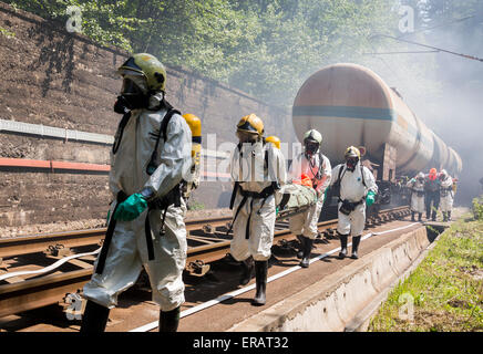 Sofia, Bulgaria - May 19, 2015: A team working with toxic acids and chemicals is saving people from a chemical cargo train crash Stock Photo
