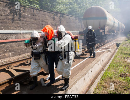 Sofia, Bulgaria - May 19, 2015: A team working with toxic acids and chemicals is saving people from a chemical cargo train crash Stock Photo