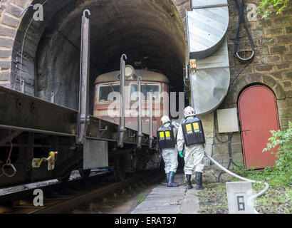 A team working with toxic acids and chemicals is saving people from a chemical cargo train crash near Sofia. Teams from Fire dep Stock Photo
