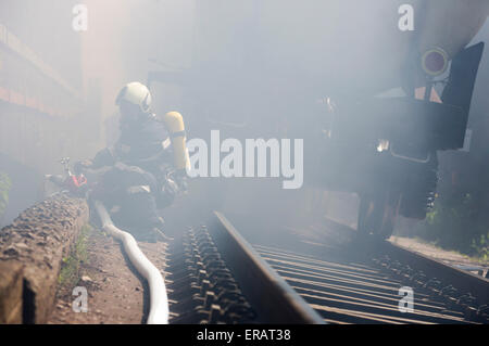 Firefighters are extinguishing chemical cargo train tanks near Sofia. Teams from Fire department are participating in an emergen Stock Photo