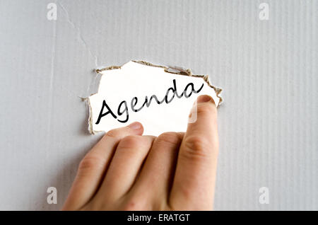 Hand and text on the cardboard background Agenda Stock Photo