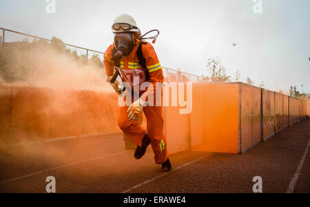 Beijing, China's Jiangsu Province. 26th May, 2015. A fireman crosses a tunnel during a firefighting competition in Nanjing, east China's Jiangsu Province, May 26, 2015. © Li Xiang/Xinhua/Alamy Live News Stock Photo