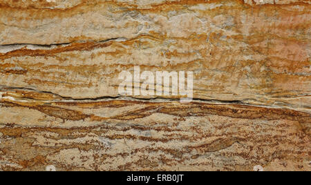 Sandstone block with bold brown and orange markings as abstract background texture Stock Photo