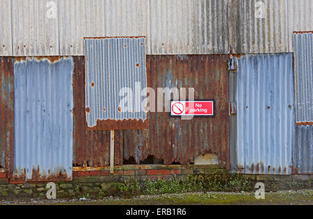 No Parking sign on wall, UK Stock Photo