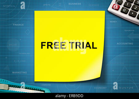 Free trial text on yellow note with graph paper Stock Photo