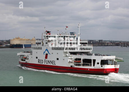 Red Funnel Ferry Red Falcon sailing down Southampton Water with Southampton Docks in the background Stock Photo