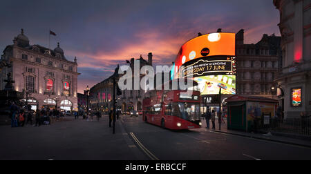 A double-decker bus drives in Piccadilly Circus, in London, England, 2015. (Adrien Veczan) Stock Photo