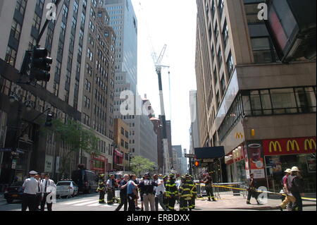 New York, USA. 31st May, 2015. Rescuers gather at the site of a crane accident in New York, the United States, May 31, 2015. At least ten people were injured by a mechanical crane in an accident at a construction site in New York's midtown on Sunday, city officials said. Credit:  David Torres/Xinhua/Alamy Live News Stock Photo