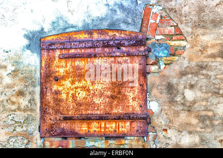 Rusty window in ruined wall of an old farmhouse in countryside in Emilia Romagna in ItalyRusty window in ruined wall of an old farmhouse in countryside in Emilia Romagna in Italy Stock Photo