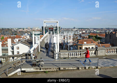 BRUSSELS, BELGIUM-MAY 27, 2015: Some people and a accordeon player on the panoramic lift Ascenseur des Marolles. It connects the Stock Photo