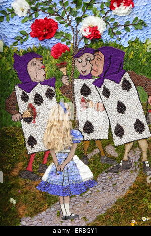 A scene from Alice in Wonderland is depicted in a traditional hand-made well dressing in the Peak District, Derbyshire, UK 2015 Stock Photo