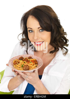 Young Happy Confident Woman Eating Authentic Italian Style Spaghetti Pasta And Meatballs Meal Isolated Against A White Background With A Clipping Path Stock Photo