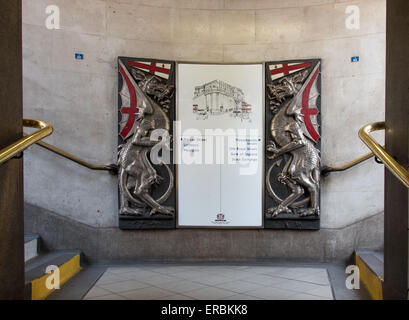 Exit sigh at Bank Station incorporating elements of the City of London coat of arms . Stock Photo