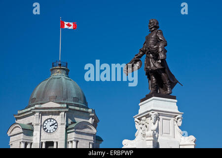 Monument of Samuel De Champlain, with the old Post Office tower in the back, Place D'Armes, Quebec City, Canada Stock Photo