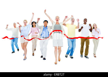 Multi-ethnic group of people running to finish line. Stock Photo