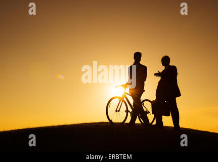 two businessmen walking along the hill Stock Photo