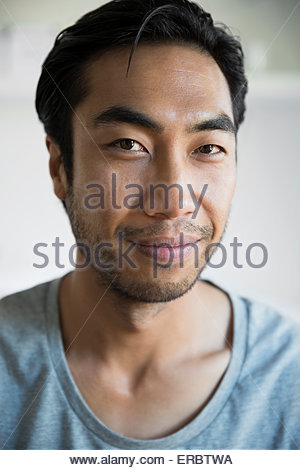 Close up portrait smiling man black hair stubble