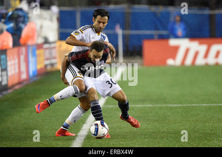 Foxborough, Massachusetts, USA. 31st May, 2015. New England Revolution defender Kevin Alston (30) battles Los Angeles Galaxy midfielder Baggio Husidic (6) to keep possession of the ball during the MLS game between Los Angeles Galaxy and the New England Revolution held at Gillette Stadium in Foxborough Massachusetts. Revolution tied Galaxy 2-2. Eric Canha/CSM/Alamy Live News Stock Photo