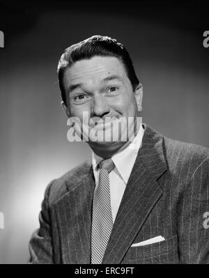 1950s MAN IN BUSINESS SUIT SMILING LOOKING AT CAMERA - p1724c DEB001 ...