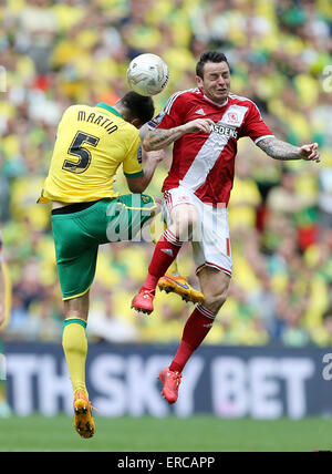 London, UK. 25th May, 2015. Middlesbrough's Lee Tomlin tussles with Norwich's Russell Martin.Sky Bet Championship Playoff Final - Middlesbrough vs Norwich City - Wembley Stadium - England - 25th May 2015 - Picture David Klein/Sportimage/CSM/Alamy Live News Stock Photo