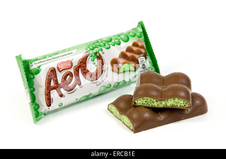 Peppermint aero chocolate bar on white background with open cut up bar by the side Stock Photo