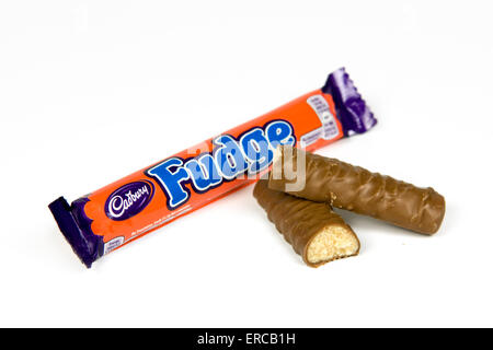 Fudge chocolate bar on white background with open cut up bar by the side Stock Photo