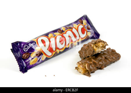 Picnic chocolate bar on white background with open cut up bar by the side Stock Photo