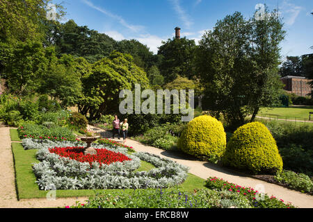 UK, England, Cheshire, Styal, Quarry Bank house gardens, visitors walking through Terrace Garden Stock Photo