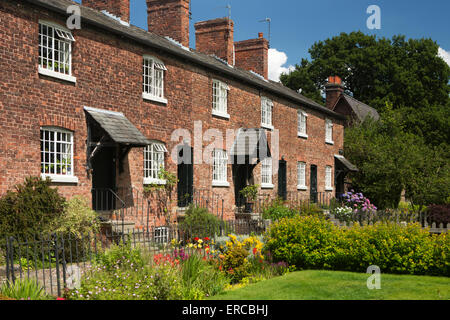 UK, England, Cheshire, Styal, Oak Cottages and gardens, terrace of mill workers houses built in early 1800s Stock Photo