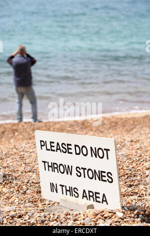 Do Not Throw Stones sign on an English Beach Stock Photo
