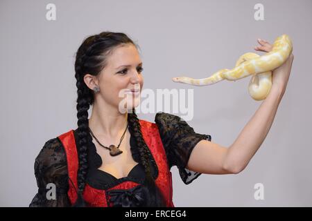 woman and Albino Burmese python Stock Photo